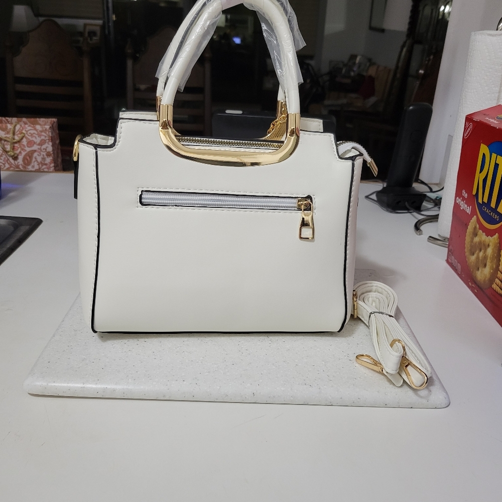 White shoulder handbag.